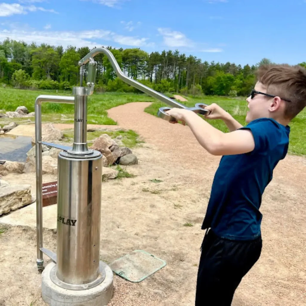 Pump-N-Play installation at Jester Park, Iowa – interactive stainless steel water play system for outdoor learning and play for State & National Parks.