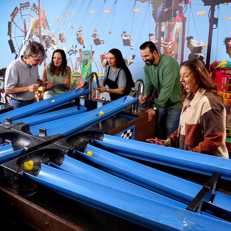 Guests using the Lil’ Ducky Racing System by Cadron Creek Play at a farm attraction